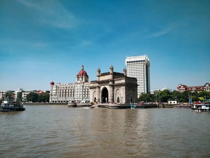 The Gateway of India and Taj Mahal Palace hotel on the Mumbai waterfront View of the Gateway of India from the sea: Maharashtra holiday packages by OYG Holidays